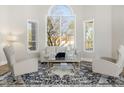 Bright living room features a large window and comfortable seating at 8757 E Lariat Ln, Scottsdale, AZ 85255