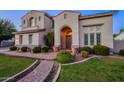 Two-story house with a well-maintained lawn and a charming facade at 1912 E Gemini Pl, Chandler, AZ 85249