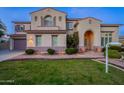 Stunning two-story home with a manicured lawn and brick pathway at 1912 E Gemini Pl, Chandler, AZ 85249