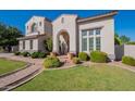 Beautiful two-story home with lush landscaping and a welcoming entry at 1912 E Gemini Pl, Chandler, AZ 85249