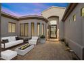Relaxing courtyard with fire pit and modern seating area at 34599 N 99Th Way, Scottsdale, AZ 85262