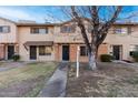 Brick townhome with a well-maintained lawn and walkway at 6742 N 43Rd Ave, Glendale, AZ 85301