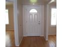 Light and bright entryway with hardwood floors and a classic white door at 3114 E Hazelwood St, Phoenix, AZ 85016