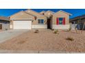 Tan two-story house with white garage door and red shutters at 7010 E Drygulch Rd, San Tan Valley, AZ 85143