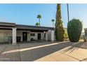 Single-story home with carport and desert landscaping at 3017 W Hearn Rd, Phoenix, AZ 85053