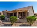 Covered patio with seating area, perfect for outdoor entertaining at 14766 W Piccadilly Rd, Goodyear, AZ 85395