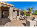 Front porch with seating and desert landscaping at 14766 W Piccadilly Rd, Goodyear, AZ 85395