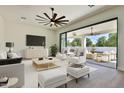 Open living room with sliding doors leading to a patio at 2041 N Orchard --, Mesa, AZ 85213