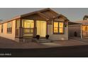 Attractive exterior, charming porch and nicely landscaped at 9302 E Broadway. -- # 147, Mesa, AZ 85208
