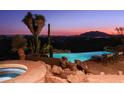 Stunning infinity pool overlooking city lights at 9215 E Red Lawrence Dr, Scottsdale, AZ 85262