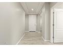 Bright and spacious entryway with tile flooring, leading to other rooms at 19034 W Yucatan Dr, Surprise, AZ 85388