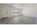 Bright and airy living room with tile floors and large window at 5714 N 19Th Dr, Phoenix, AZ 85015