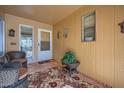 Cozy entryway with wicker chairs and a patterned rug at 12946 W Ashwood Dr, Sun City West, AZ 85375