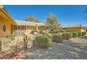 Landscaped front yard with a walkway leading to the home's entrance at 12946 W Ashwood Dr, Sun City West, AZ 85375