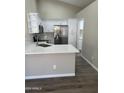 Modern kitchen with stainless steel appliances and white cabinets at 15075 W Amelia Dr, Goodyear, AZ 85395