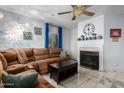 Cozy living room featuring a fireplace and sectional sofa at 1825 W Ray Rd # 1001, Chandler, AZ 85224