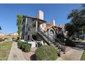 Two-story building with Spanish tile roofing and a walkway at 19820 N 13Th Ave # 283, Phoenix, AZ 85027