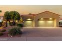 Two-story house with a two-car garage and desert landscaping at 13232 W Los Bancos Dr, Sun City West, AZ 85375