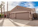 Spacious two-car garage with additional gated side access at 568 N Falcon Dr, Gilbert, AZ 85234