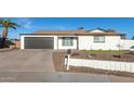 Single story home with updated exterior and a two-car garage at 12043 N 46Th Ave, Glendale, AZ 85304