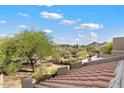 Scenic view of desert landscape with mountains in the background at 9220 E Whitethorn Cir, Scottsdale, AZ 85266