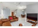 Bright living room with tile flooring and adjacent dining area at 8333 W Wescott Dr, Peoria, AZ 85382