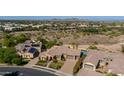 Aerial view of a beautiful home with a resort-style backyard and pool at 7588 W Quail Ave, Glendale, AZ 85308