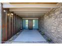 Covered entryway with stone and metal features at 8787 E Whispering Wind Dr, Scottsdale, AZ 85255