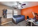 Bright bedroom with a daybed, workspace, and large windows at 2071 E Remington Pl, Chandler, AZ 85286