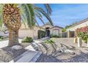 House exterior with a palm tree and gravel driveway at 17900 N 80Th Pl, Scottsdale, AZ 85255