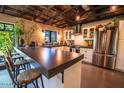 Modern kitchen with stainless steel appliances and an island at 2317 W Dobbins Rd, Phoenix, AZ 85041