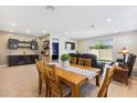 Dining area with wood table and access to backyard at 24884 N 171St Ln, Surprise, AZ 85387