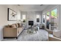 Living room boasts a marble fireplace, ample natural light, and comfortable seating at 2340 W Horsetail Trl, Phoenix, AZ 85085