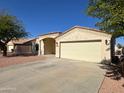 Newly built single-story home with a two-car garage at 414 E 5Th St, Eloy, AZ 85131