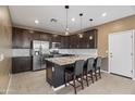 Modern kitchen with granite countertops and stainless steel appliances at 29380 N 122Nd Gln, Peoria, AZ 85383