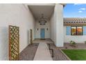 Inviting entryway with a blue door and a charming walkway at 454 E Hackamore St, Mesa, AZ 85203