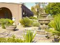 Landscaped courtyard with a beautiful fountain at 7920 E Camelback Rd # 509, Scottsdale, AZ 85251