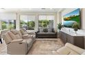 Spacious living room with comfortable seating and large TV at 17543 E Silver Sage Ln, Rio Verde, AZ 85263
