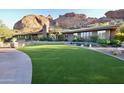 Beautiful home exterior with lush landscaping and mountain backdrop at 5123 E Mcdonald Dr, Paradise Valley, AZ 85253