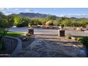 Landscaped yard with stone pathway leading to the home entrance at 5123 E Mcdonald Dr, Paradise Valley, AZ 85253