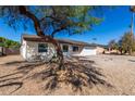 Single story home with front yard landscaping and a spacious driveway at 15840 N 22Nd St, Phoenix, AZ 85022