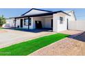 Remodeled home with artificial turf, carport and new paint at 1737 N Trevor Dr, Mesa, AZ 85201