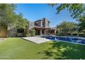 Inviting backyard pool with expansive lawn and patio at 20242 N 103Rd Way # 1246, Scottsdale, AZ 85255