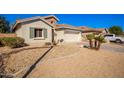 Landscaped front yard with gravel and desert plants at 980 S 220Th Ln, Buckeye, AZ 85326