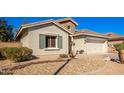 Charming house with a well-manicured front yard at 980 S 220Th Ln, Buckeye, AZ 85326