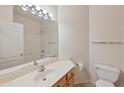 Clean bathroom with a vanity, toilet, and bathtub at 6879 W Blackhawk Dr, Glendale, AZ 85308