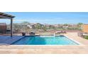 Enjoy this beautiful pool with water features and spacious patio at 16918 S 180Th Dr, Goodyear, AZ 85338