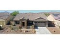 Single story home with tile roof and two car garage at 16918 S 180Th Dr, Goodyear, AZ 85338