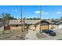 Single-story home with a two-car garage, pool, and solar panels at 15402 N 56Th Ave, Glendale, AZ 85306