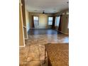 Spacious living room with tile and laminate flooring at 9406 W Elwood St, Tolleson, AZ 85353
